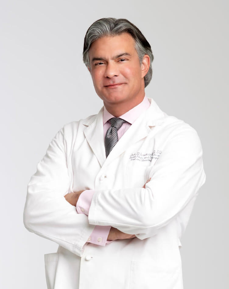 Dr. Perenack headshot in white lab coat